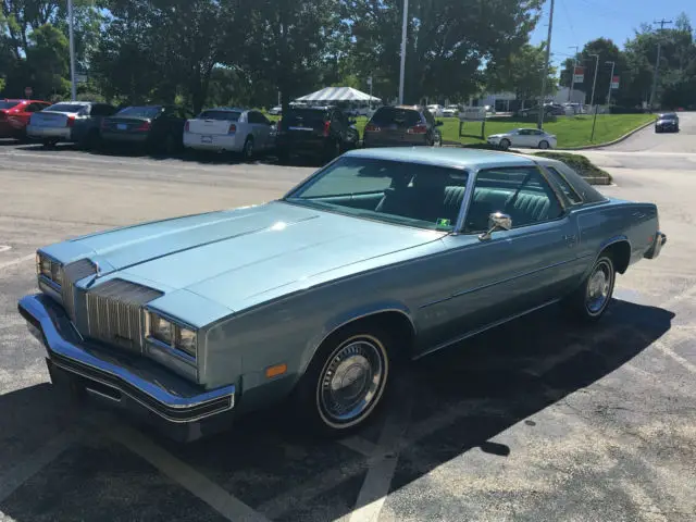 blue oldsmobile cutless supreme coupe*5.7 v8 auto.trans* a/c. runs & looks good