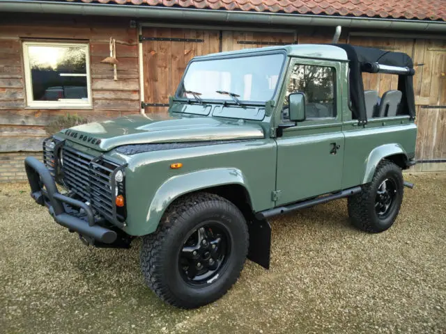 land rover defender 90 truck cab in keswick green, restored with new engine
