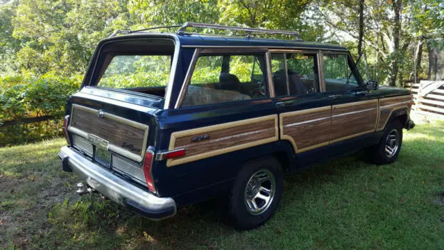 1987 dark blue jeep grand wagoneer