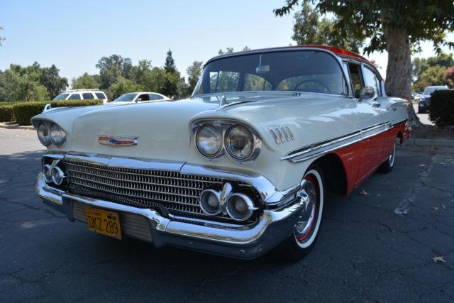 1958 chevrolet biscayne deluxe 14,634 miles red and white sedan 6 cyl manual
