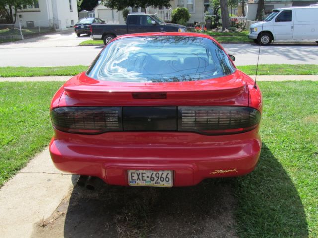 1994 pontiac firehawk in flame red with graphite leather
