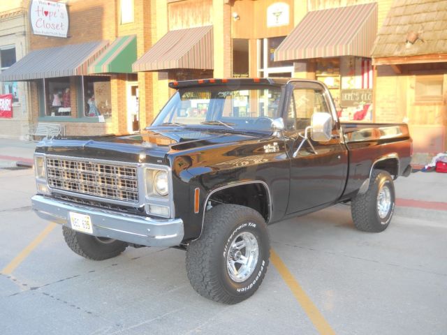 1979 chevy custom deluxe pick up. black/black with lift kit on 33 x 12.5 tires