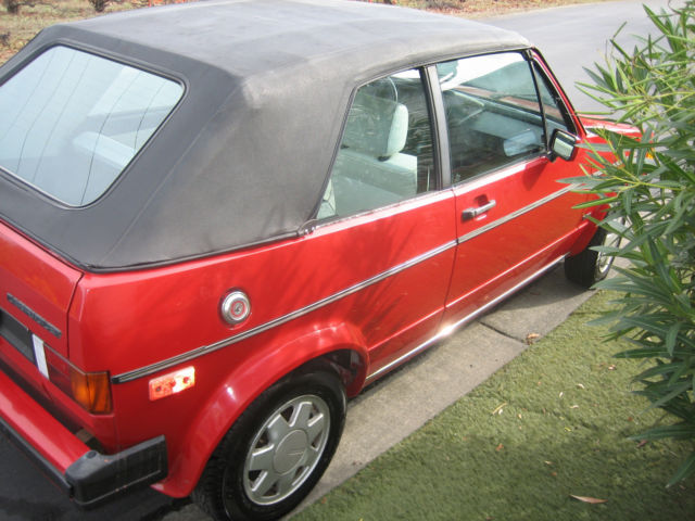 1986 volkswagen cabriolet, clean red convertable, perfect first car for the kids