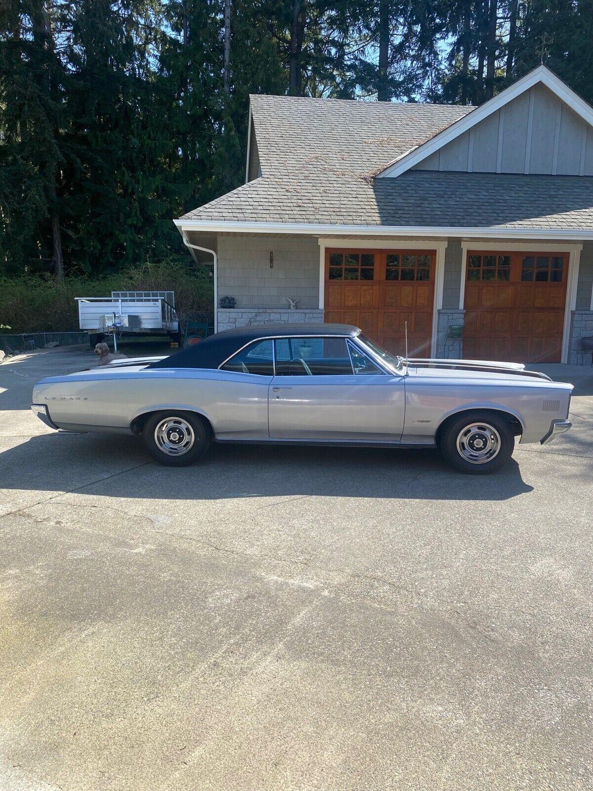1966 pontiac le mans silver with black vinyl roof and black stripes