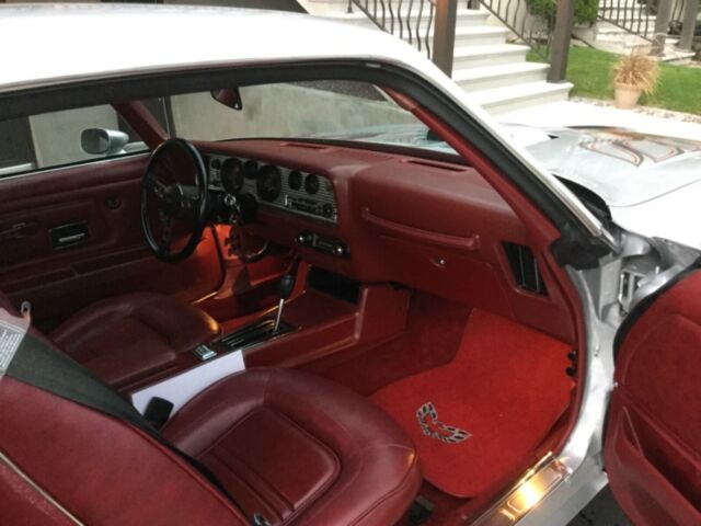 1975 pontiac trans am w/ pristine silver exterior and ox blood leather interior