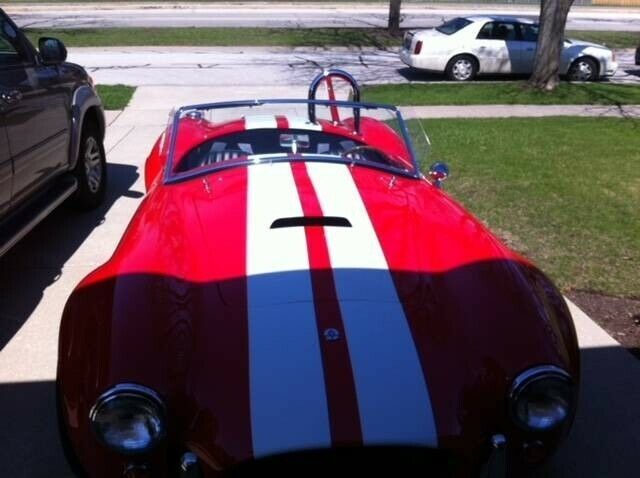 ford cobra red with 3,600 miles, for sale!