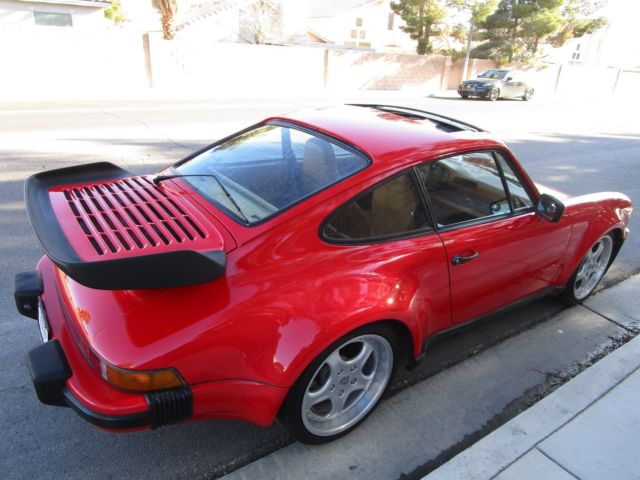 steel wide body 930 turbo look, guards red with cork leather, stunning classic!