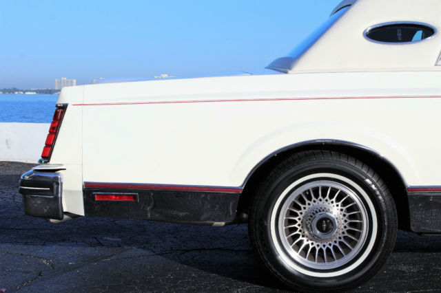 only 11k actual miles beautiful white with garnet velour plush interior mark 6