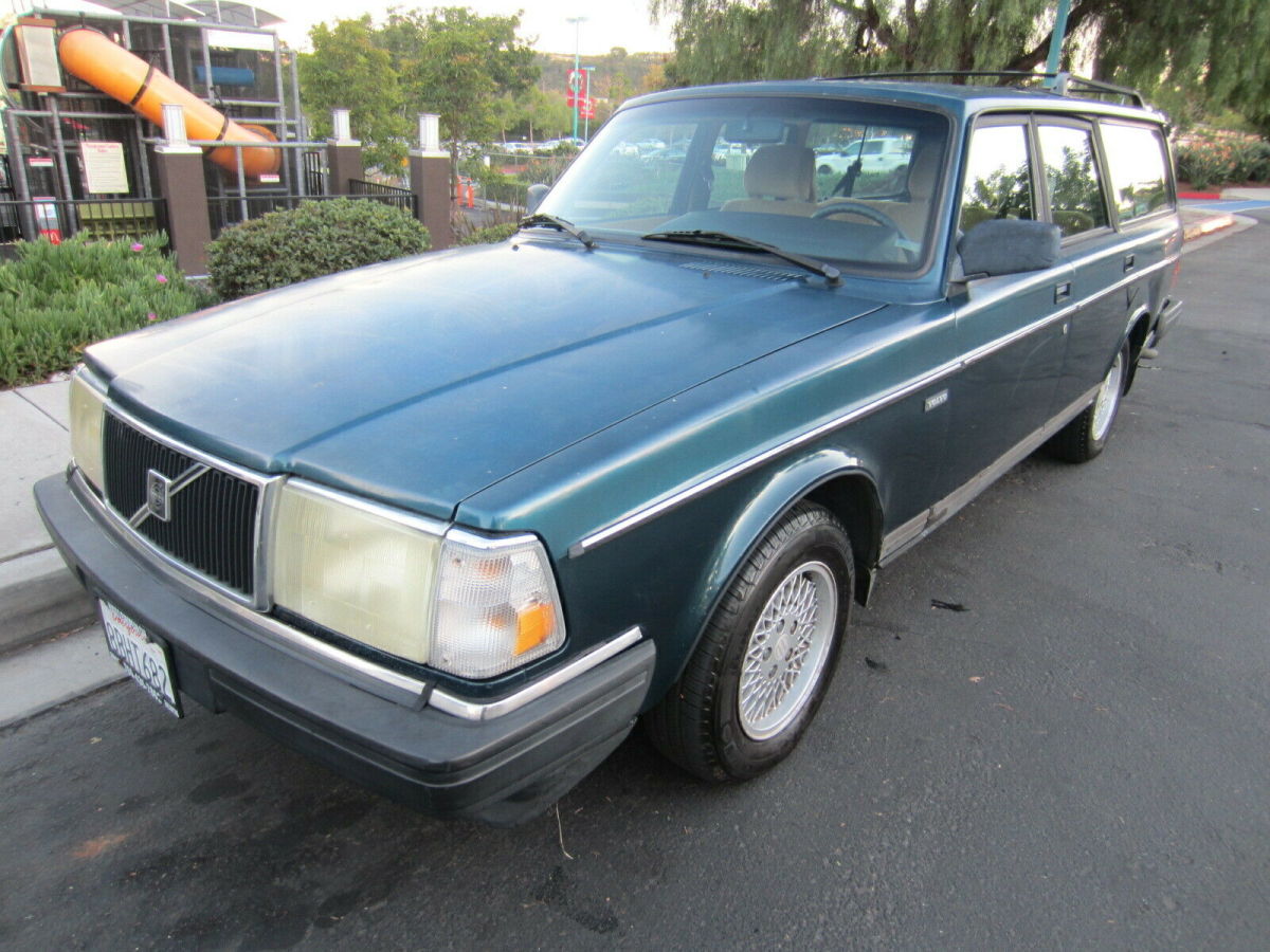 1993 volvo wagon - with 166,800 miles - has classic wheels and wood dash trim