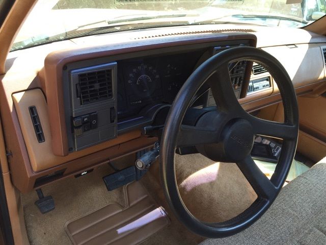 1989 chevrolet 1500 pickup, silverado pkg, brown and tan color. mint condition