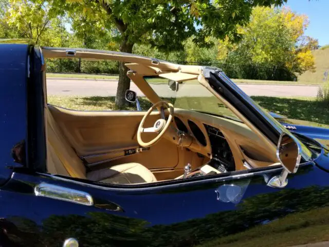 28,000 miles. great color combo, black with tan leather interior! ac glass t-top