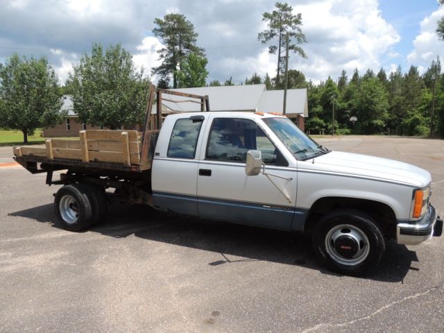 1992 gmc 3500 sle ext cab flatbed stakebody dump truck in mississippi no reserve