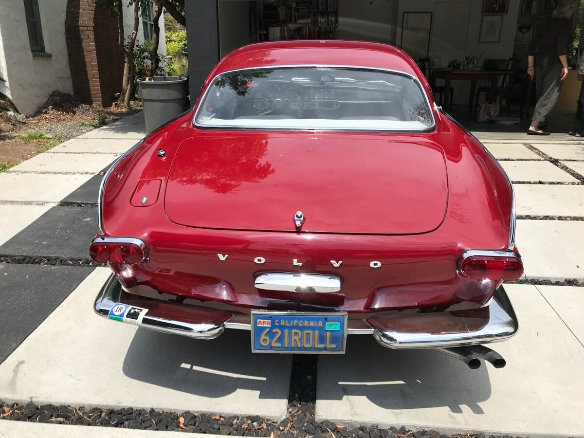 1962 red volvo p1800
