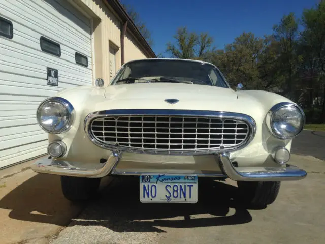 1964 volvo p1800s and 1963 jensen volvo p1800s