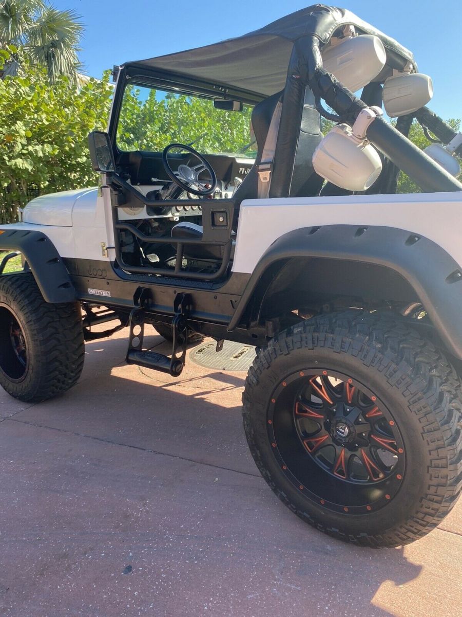 350 v8, power steering, 35" tires, 20" wheels, rhino lining