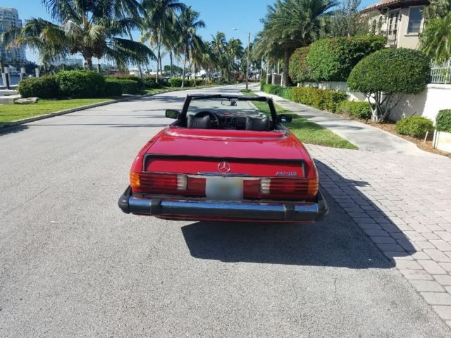 1980 450sl only 86k miles. red over black. amg look. new soft top
