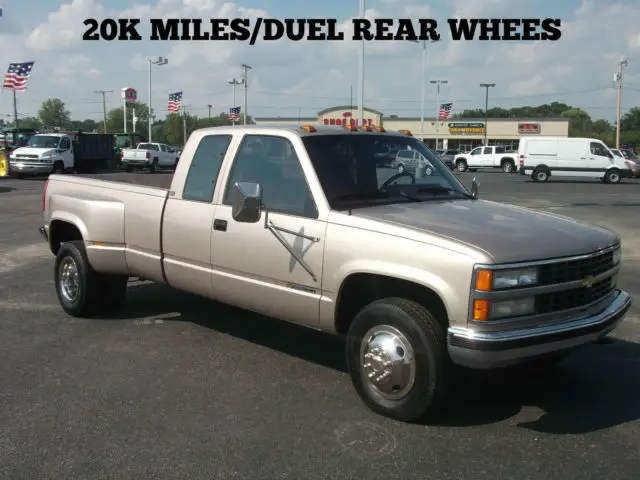 one owner 19000 actual miles 454 big block dually extend cab gold red cloth int