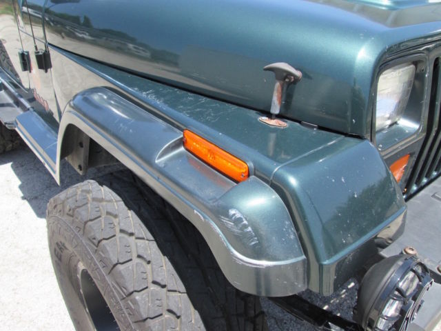 just 50k miles! solid florida jeep sahara! 4.0 5-speed! new top & tires! wow!