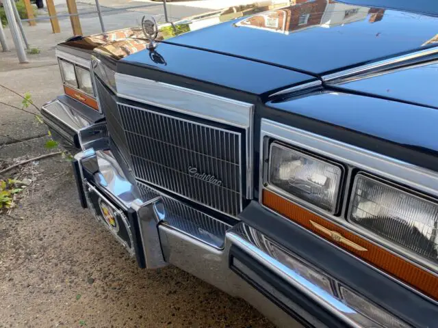 1986 cadillac fleetwood coupe black rwd automatic brougham
