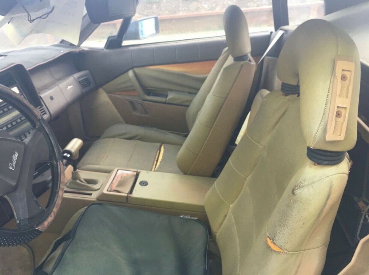 1988 black cadillac allante tan leather interior, 95k miles, soft and hard top