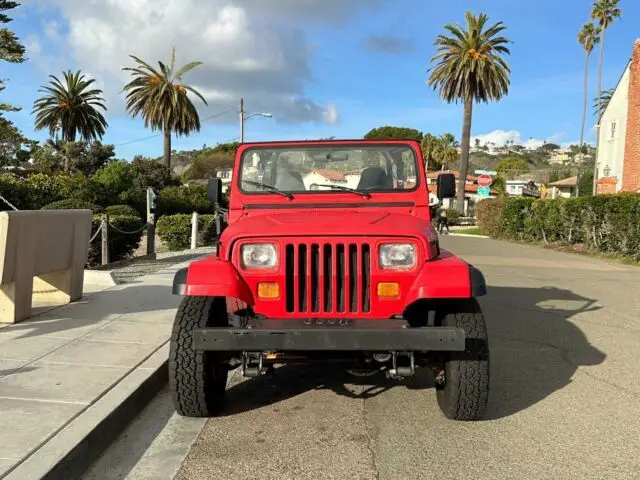 1989 jeep wrangler, red on black, 5 speed, new suspension and wheels, inspected