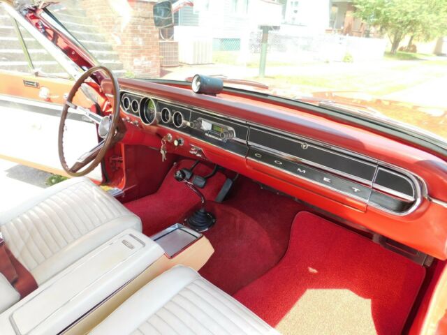 red and white 1965 mercury comet cyclone v-8
