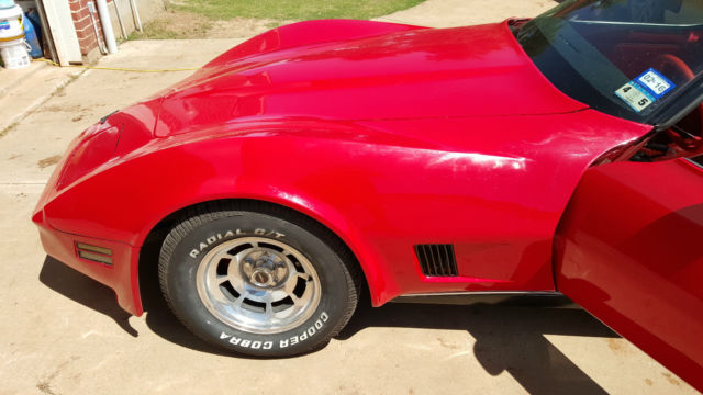 1980 red corvette with t-tops