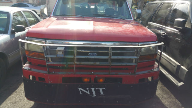 tow truck with twin cable extendable boom and wheel lift
