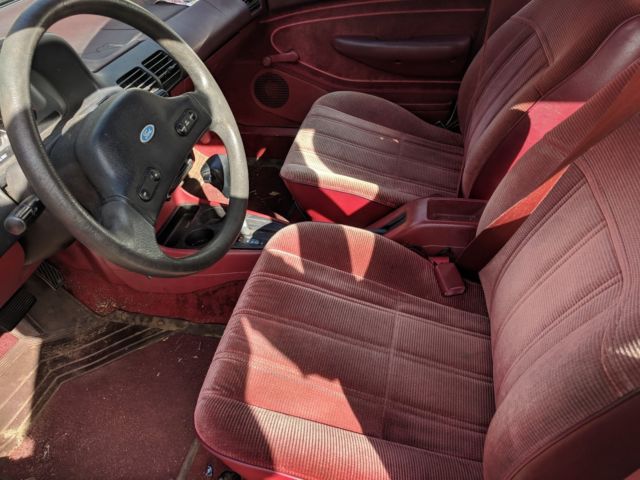 ford escort lx 33 mpg! reliable auto.seatbelts cruise 1/2 life left!