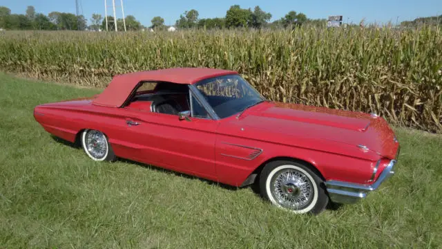 1965 red ford thunderbird convertible with tonneau cover (ford executive car)