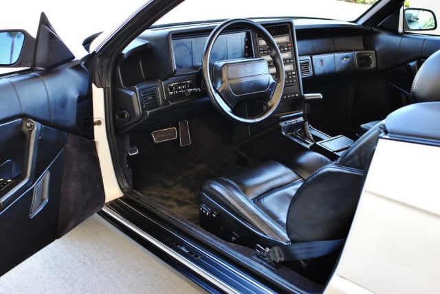 pearl white w/ black leather interior & black cloth top