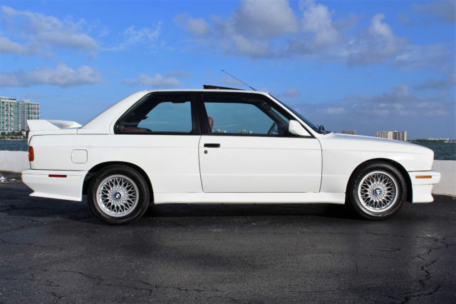 only 58k actual miles, rare alpine white over cardinal red leather, clean carfax