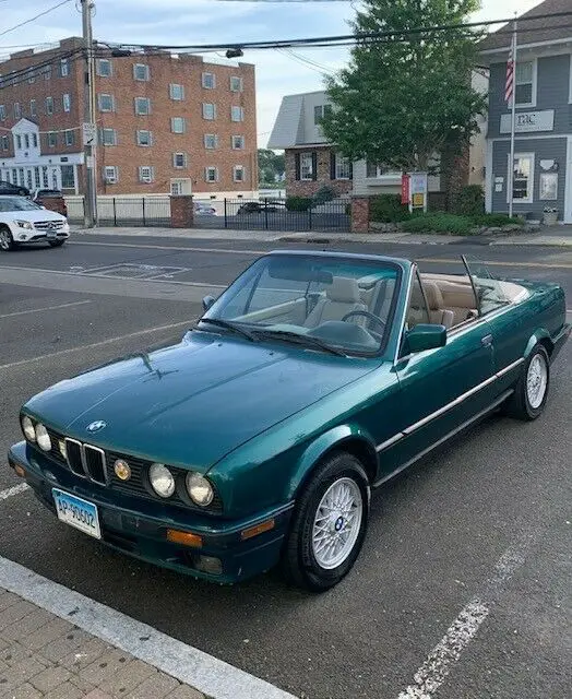 beautiful dark metallic green with tan leather interior