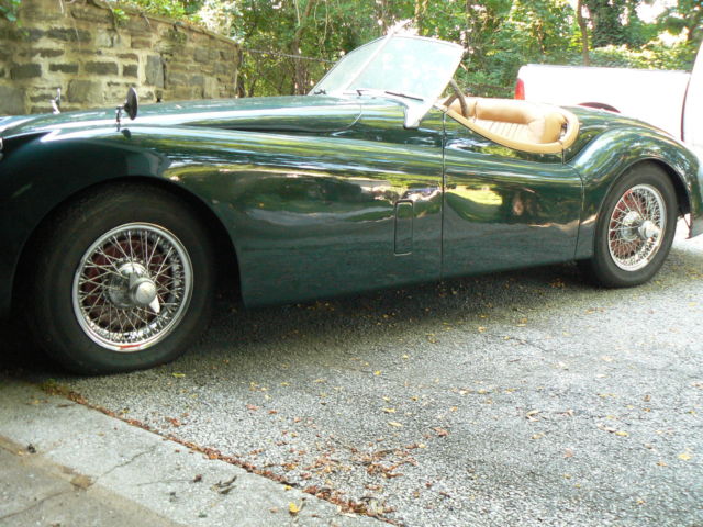 a nice xk 120 jaguar ots needs attention from sitting, a cleaning & fresh fuel