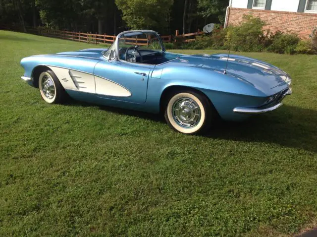 1961 jewel blue corvette with white convertible top