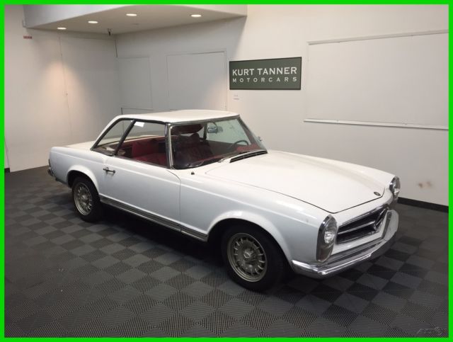 1964 mercedes 230sl convertible. white with red trim. running and driving