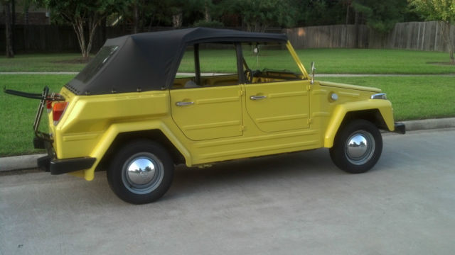 yellow 1974 vw thing with 4 side windows