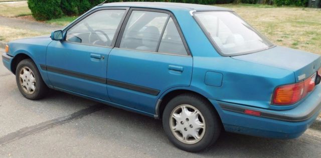 94 mazda protege turquoise color it runs like new!