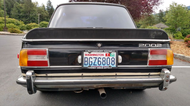 1976 bmw 2002 4spd with rust and cheap wheels