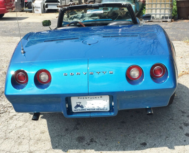 1974 corvette convertible. beautiful metallic blue with white soft top clean