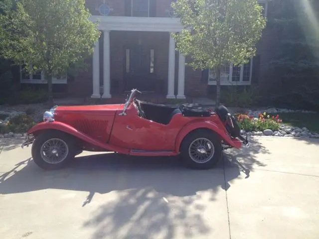 1950 mgtd roadster convertible $18,000. ferrari red. full body restoration