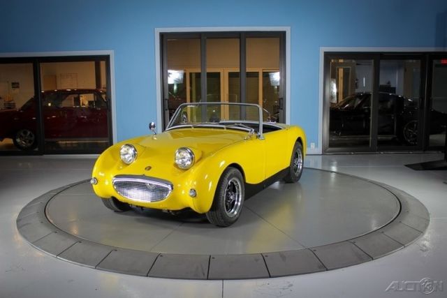 yellow classic sports car
