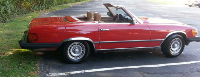 red 1984 mercedes 380sl two tops