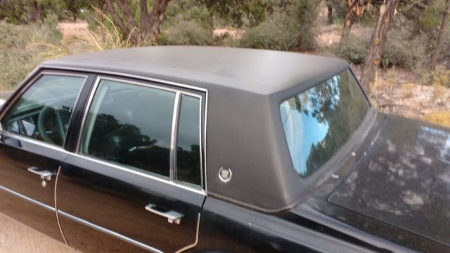 triple black 1977 cadillac seville