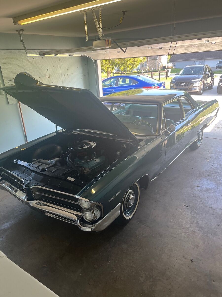 1965 pontiac catalina coupe green rwd automatic. it’s really amazing all origina
