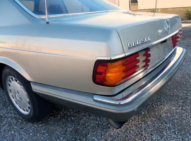 1987 mercedes 560sec smoked silver/brazil brown coupe