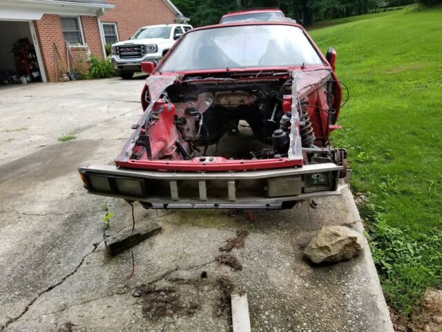 1985 porsche 928s parts car red in color