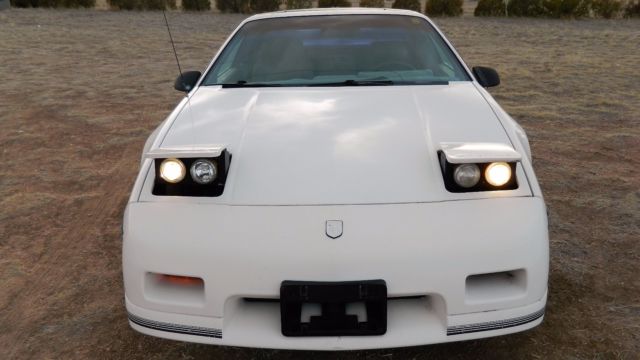 1988 fiero gt white includes series 2 gtp parts for install and parts for cradle