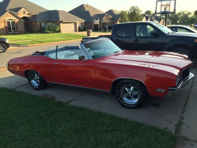 convertible red 1970 sklylar with cragers tires and 350 dual exhaust