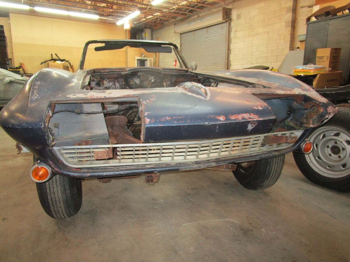 66 corvette convertible project. rusty windshield frame